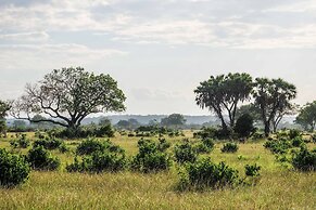 Saadani Safari Lodge - bush, river, beach