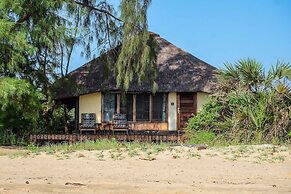 Saadani Safari Lodge - bush, river, beach