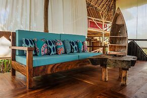 Saadani Safari Lodge - bush, river, beach