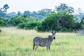 Saadani Safari Lodge - bush, river, beach