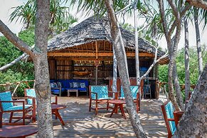 Saadani Safari Lodge - bush, river, beach