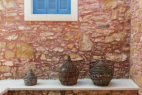 Dine on the Generous Veranda at a Rustic Stone Getaway