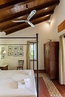 Dine on the Generous Veranda at a Rustic Stone Getaway