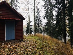Tiny hut in the Forest Overlooking the River