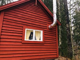 Tiny hut in the Forest Overlooking the River
