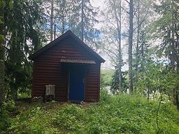 Tiny hut in the Forest Overlooking the River