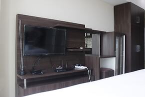 Modern Studio Room at Tamansari La Grande Apartment