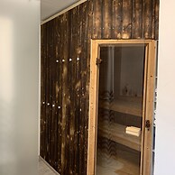 Holiday home with sauna and garden lounge