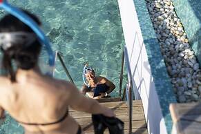 OUTRIGGER Maldives Maafushivaru Resort