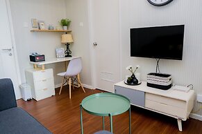 Elegant 1BR Parahyangan Residence Apartment With Mountain View