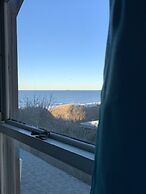 Rustic Rooftop Delight - Bay Front 2 Bedroom Apts by RedAwning