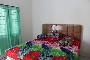 Penginapan Transit Tomato