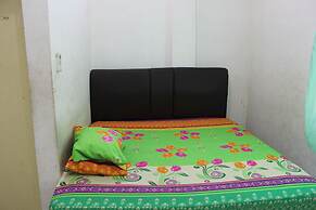 Penginapan Transit Tomato