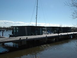 Beautiful Houseboat in the Harbour of Volendam Near Centre