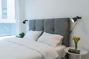 Sunlit Urban Escape with Balcony by Sea N Rent