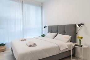 Sunlit Urban Escape with Balcony by Sea N Rent