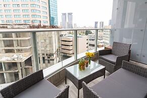 Sunlit Urban Escape with Balcony by Sea N Rent
