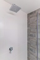 Sunlit Urban Escape with Balcony by Sea N Rent