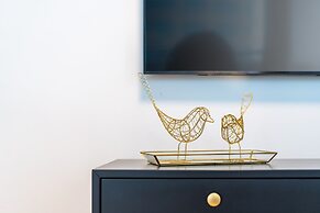 Sunlit Urban Escape with Balcony by Sea N Rent