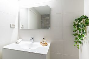 Sunlit Urban Escape with Balcony by Sea N Rent