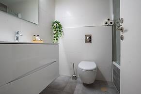 Sunlit Urban Escape with Balcony by Sea N Rent