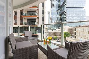 Sunlit Urban Escape with Balcony by Sea N Rent