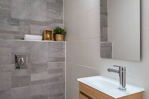 Sunlit Urban Escape with Balcony by Sea N Rent