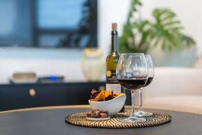 Sunlit Urban Escape with Balcony by Sea N Rent