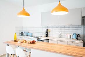 Sunlit Urban Escape with Balcony by Sea N Rent