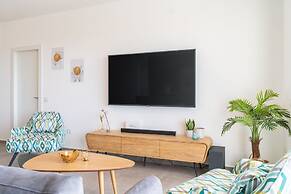 Sunlit Balcony & Coastal Charm by Sea N' Rent