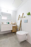 Sunlit Balcony & Coastal Charm by Sea N' Rent