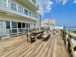 Coral Palace Onna by Sunset Avenue