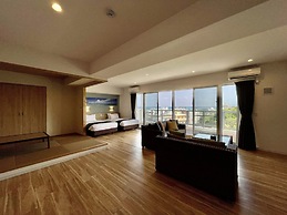 Coral Palace Onna by Sunset Avenue