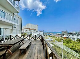 Coral Palace Onna by Sunset Avenue