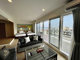 Coral Palace Onna by Sunset Avenue