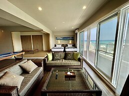 Coral Palace Onna by Sunset Avenue