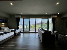 Coral Palace Onna by Sunset Avenue