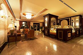 Magnum Hotel & Suites West Bay