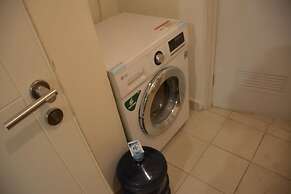 Homey And Cozy Stay 2Br At Casa Grande Apartment