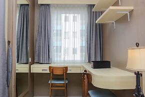 Comfort And Strategic Studio At The Nest Puri Apartment By Travelio