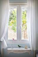 Cute Yellow Handmade House With Garden