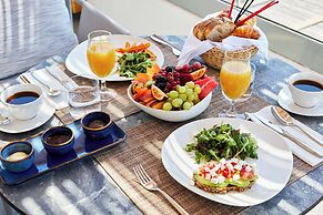 Sea Breeze Santorini Beach Resort, Curio Collection Hilton