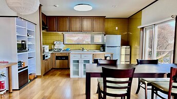 Yellow House by Lake Toya