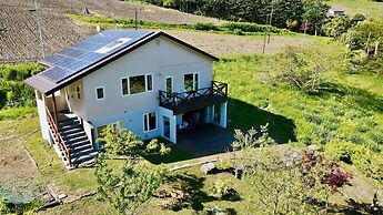 Yellow House by Lake Toya