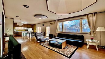 Yellow House by Lake Toya