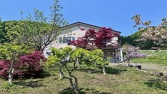 Yellow House by Lake Toya