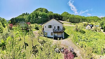 Yellow House by Lake Toya