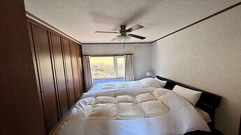 Yellow House by Lake Toya