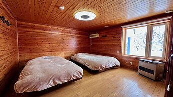 Yellow House by Lake Toya