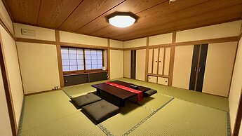 Yellow House by Lake Toya